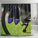 A shower curtain in a bathroom, the shower curtain having an image of a pair of purple high heel shoes hung on the spokes of a bicycle, along with a personal message printed on the curtain