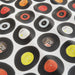 a closeup of duvet cover showing some vinyl records