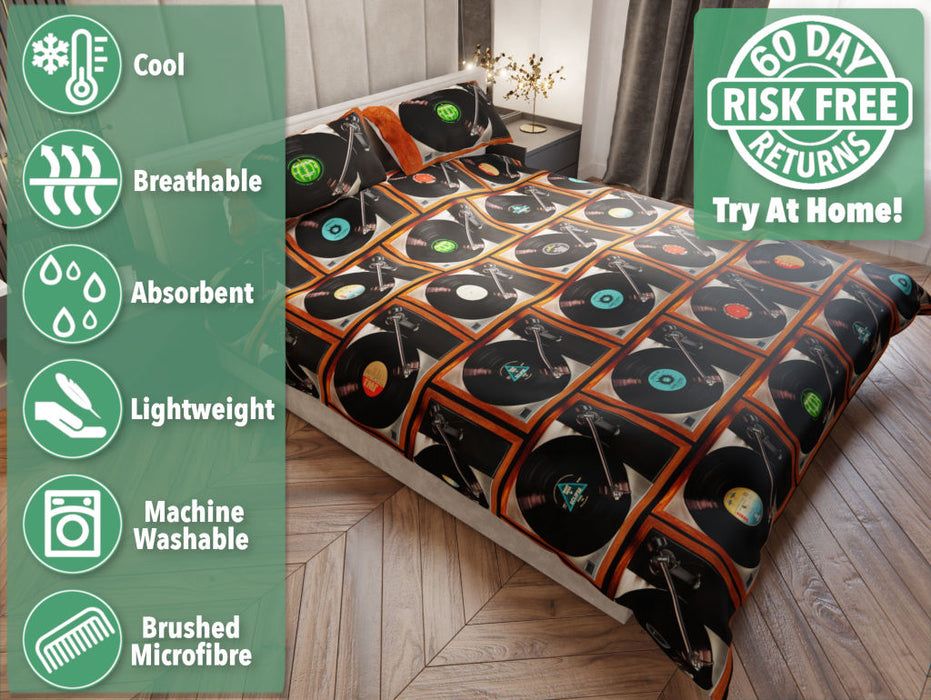 a bed with a duvet cover showing a mosaic image of record players, with vinyl records playing, seen from a point high and left about the bed