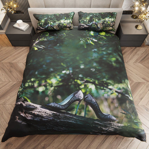 A duvet cover on a bed, the duvet showing image of a pair of shoes resting on the brach of a tree within a forest