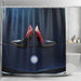 A shower curtain in a bathroom, the shower curtain having an image of a pair of purple and red high heel shoes resting on the bonet of a high performance car, seen from above