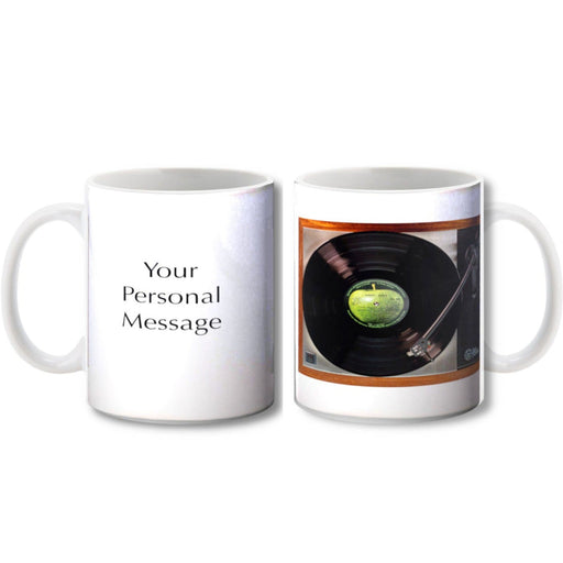 Two ceramic tea and coffee mugs, one showing a record player with a vinyl record playing, the other mug showing a personal message