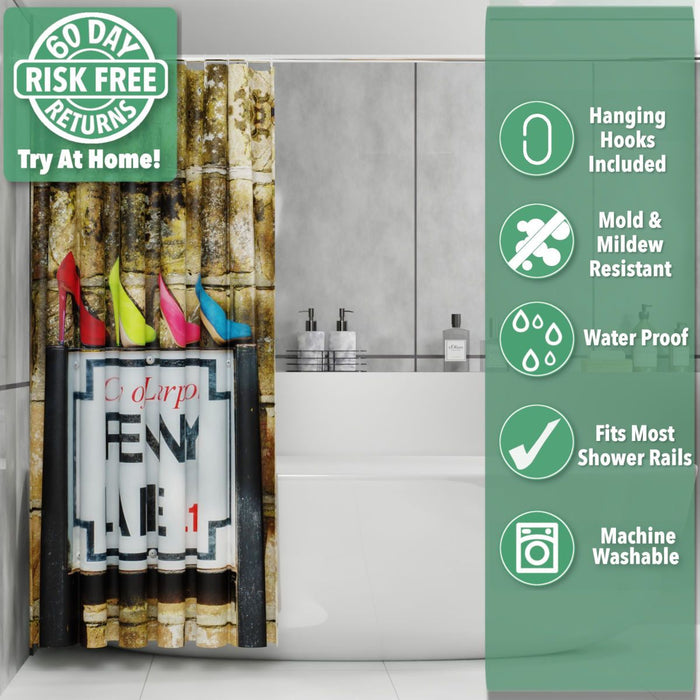 A shower curtain in a bathroom, the curtain having an image of the penny lane road sign in liverpool, upon the sign are four coloured high heel shoes, the curtian is pushed back and folded