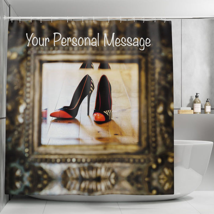 A shower curtain with an image of a pair of orange and black high heel shoes seen reflected in a mirror, there is a personal message printed on the curtain