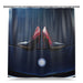A shower curtain showing an image of a pair of purple high heel shoes resting on the bonet of a high performance car, with a white background