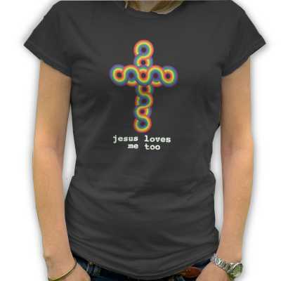 A woman wearing a black Tshirt, the Tshirt has a crucifix pattern on it made from the colours of the rainbow, there is also a message below the cross saying jesus loves me too