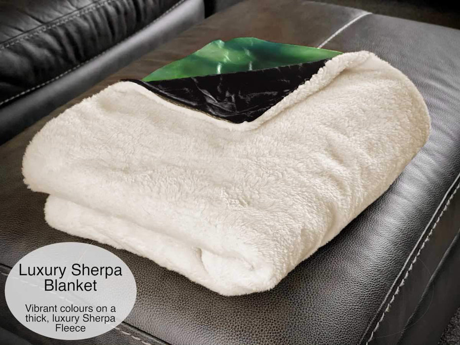 A white folded sherpa blanket showing the fleece rear