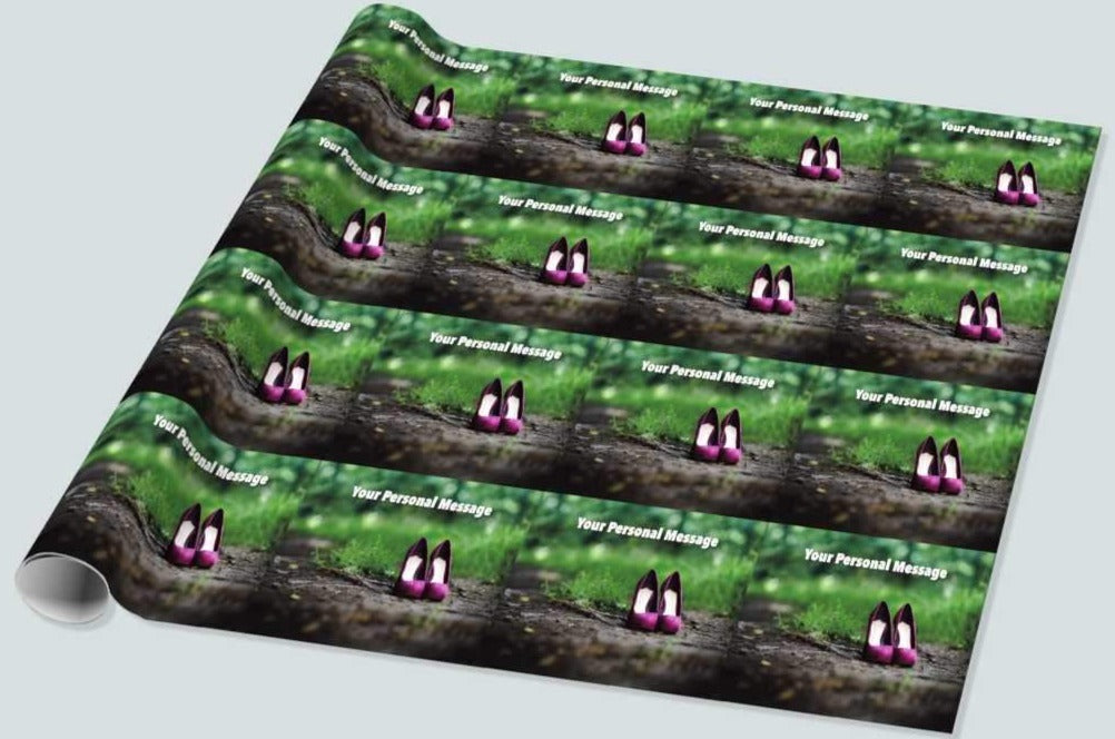 A roll of wrapping paper with an image of a pair of purple high heel shoes standing on a woodland path, the image is repeated in a mosaic pattern