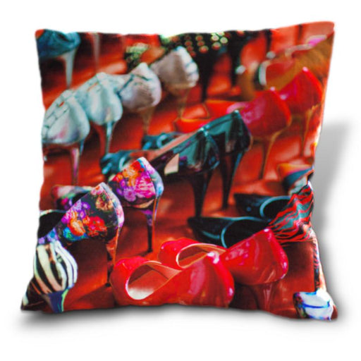 An image of a cushion, the cushion cover showing lots of high heel shoes arraged in rows