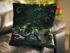 An image of a cushion sat on a couch, the cushion cover shows a pair of shoes sat on a tree branch within a forest woodland
