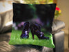 An image of a cushion on a couch, the cushion having a cover showing a pair of purple high heel ankle boots sat upon a garden lawn