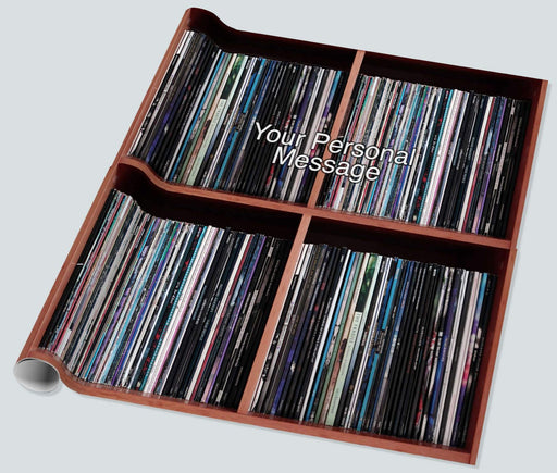 gift wrapping paper laid out flat, showing large image of vinyl records stacked along a shelf with a personal message