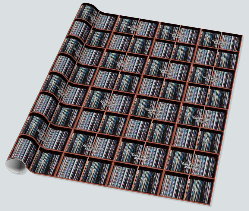 gift wrapping paper laid out flat, showing medium image of vinyl records stacked along a shelf with a personal message