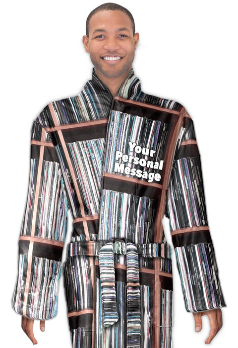 A man wearing a dressing gown decorated with vinyl records with a personal message on the bathrobe, the man is seen from the front