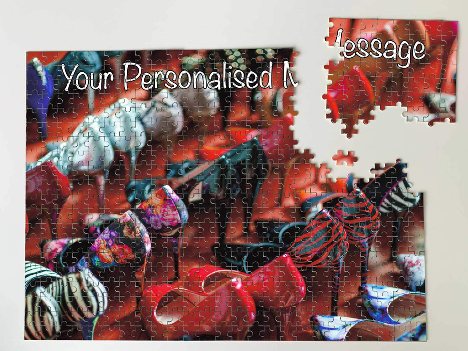 A jigsaw seen from the top, the jigsaw having an image with lots of ladies high heel shoes, along with a personal message, the jigsaw is broken into a few pieces