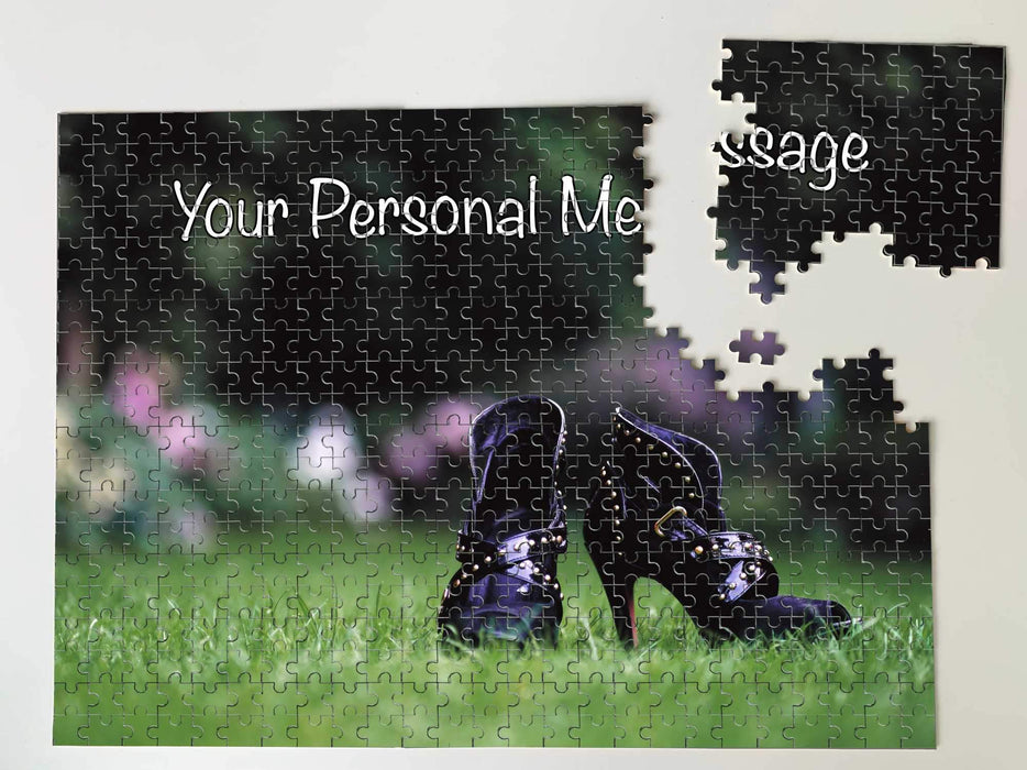 A jigsaw with an image of a pair of purple high heel boots on a garden lawn, the jigsaw is partially broken