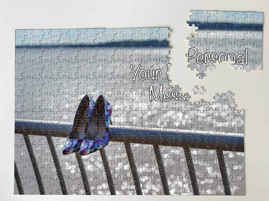 A jigsaw image of a ocean with a pair of high heel shoes hanging on the railings in the foreground, the jigsaw is partially broken