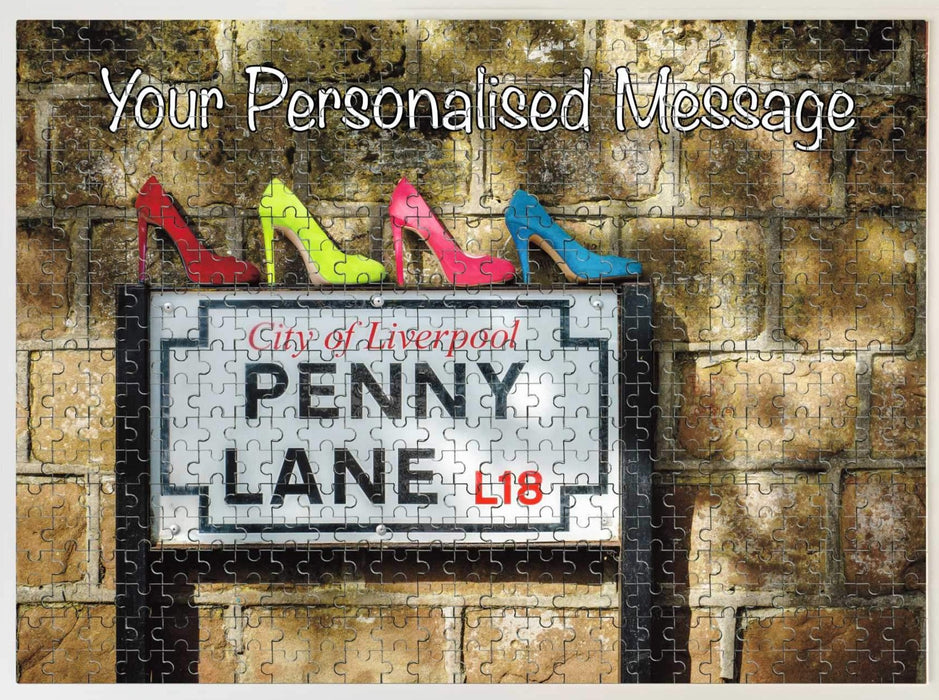 A jigsaw seen from the top, the jigsaw having an image of the famous penny lane road sign with four coloured shoes sat upon the road sign, along with a personal message,