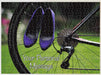 A jigsaw seen from the top, the jigsaw having an image of a pair of purple high heel shoes hung on the rear wheel of a road bike, along with a personal message