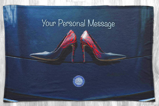 A blanket with an image of a pair of high heel shoes on the bonet of