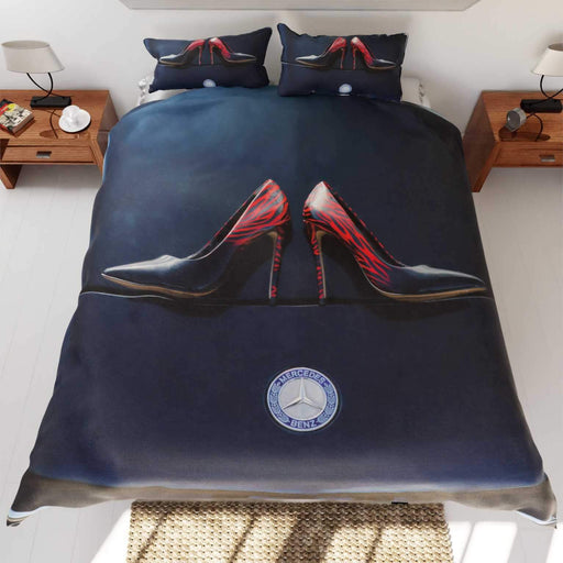 A duvet on a bed, the duvet having an image of a pair of shoes on the bonet of a dark blue high performance car