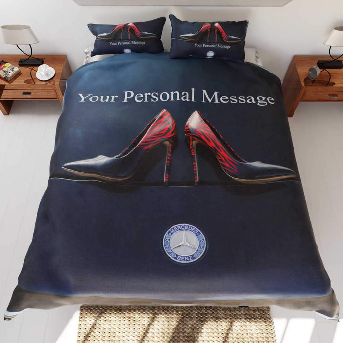 A duvet on a bed, the duvet having an image of a pair of shoes on the bonet of a dark blue high performance car, along with a personalised message