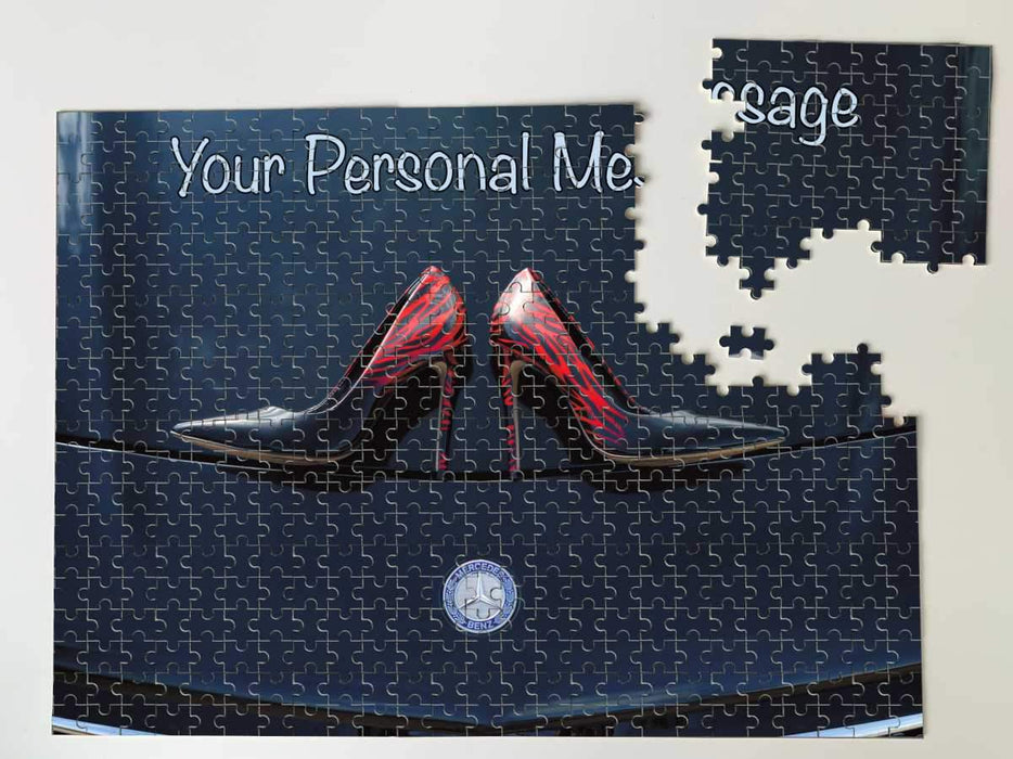 A jigsaw with an image of a pair of blue high heel shoes on the bonnet of a high performance car, along with a printed personal message, the jigsaw is partially completed