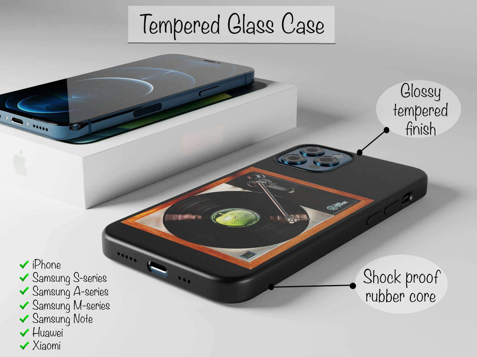 A mobile phone case with a vinyl record player, case shown to be black rubber sides and tempered glass, all seen from angled position. There is some text showing that Apple, Samsung, Huawei and Xiaomi available