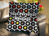A cushion sat on a couch, the cushion decorated with an image of vinyl records arranged in a mosaic pattern, on a white background, along with a personal message on the cushion