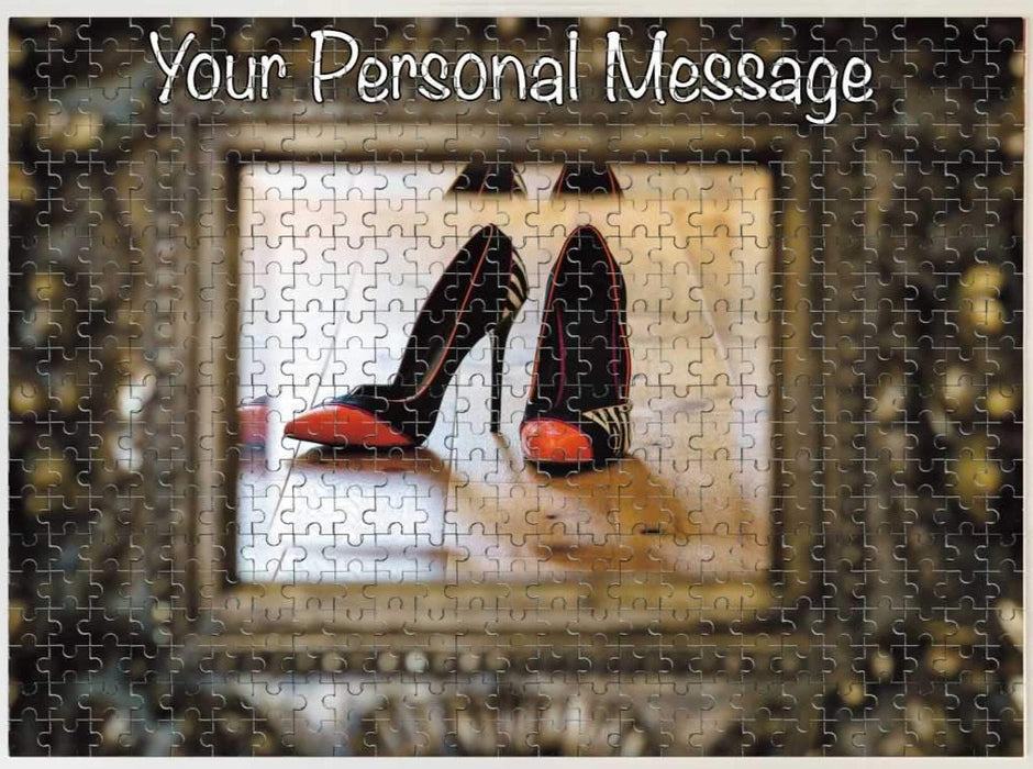 A jigsaw with an image of a pair of orange and black high heel shoes reflected in a brass mirror, along with a printed personal message