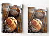 a pair of notebooks, one spiral bound, one hard back, next to each with image of two large sourdough loaves sat on a wire rack upon a table and seen from angled position