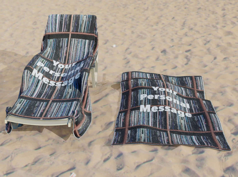 a towel with image of vinyl records stacked along shelves along with a printed personal message, the towel on a lounger on a beach with an identical towel on the sand beside it