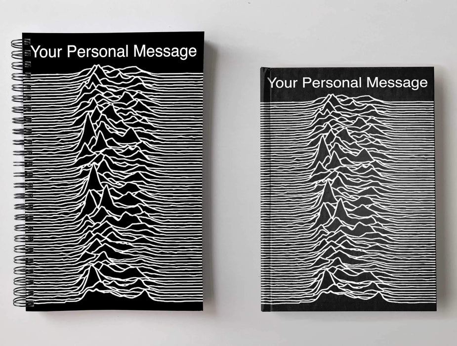 Two notebooks side by side, one a spiral bound and one a hard back, both having front covers with joy divisions famous unknown pleasures pulsar image, along with a personal message printed on the books