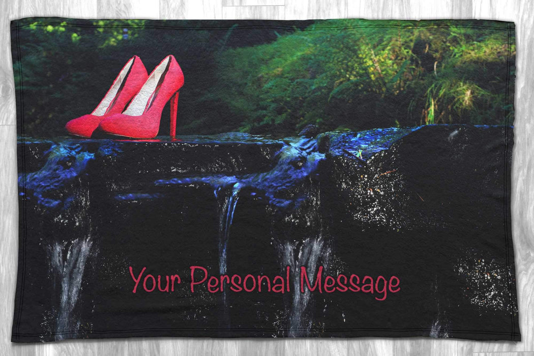 a blanket flat of a wooden floor showing a pair of shoes midway across a flowing river with a personal message printed