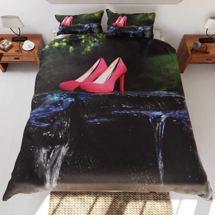a duvet and pillow set on a bed, the duvet and pillow having an image of a pair of pink high heels standing in a shallow flowing river